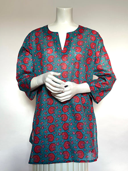 This delightful Summer tunic is 100% lightweight, block-printed Indian cotton. It's a terrific,classic and versatile cut which is wearable with leggings, capris, shorts, skirts, you name it! It has a flattering shoulder fit from which it flares slightly into a body-skimming silhouette with side seams open over the hips. It's washable in cold water, and hang dries quickly. This print is a fun floral vine print in deep red with touches of pink on an aegean blue background.