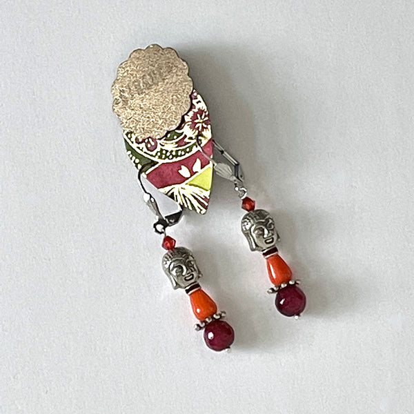  These earrings are carefully crafted out of pewter Buddha beads, faceted tinted agate in a blend of red and magenta with coral-red glass beads and tiny crystals. They are finished off with stainless steel hooks and measure approximately 2" in length. They are also lightweight at 8g/pair.