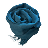 With its 100% European stonewashed woven linen fabric, this scarf will become only softer with every wash. In a Deep Teal Blue colour that reminds of french navy.  Easy to care for, wash your linen on the gentle cycle with non-chloride detergent, and tumble dry on low settings to help your linen become softer. Wrinkles are part of linen natural charms, but if you prefer a pressed look, iron with medium heat or use a steamer. 18" x 80" with fringe at both ends.  Handmade in India. 