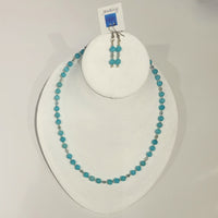 Single strand necklace of small round bright turquoise amazonite beads spaced with pale blue crystals and tiny silver beads, and matching short drop earrings set