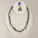 Single strand necklace of asymmetrical chunky turquoise and small round bronze beads and matching short drop earrings 