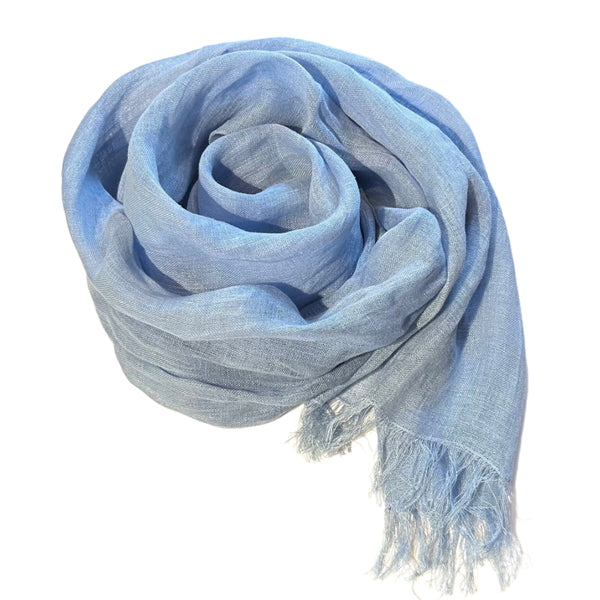 With its 100% European stonewashed woven linen fabric, this scarf will become only softer with every wash. In a bright mid-tone blue colour. Easy to care for, wash your linen on the gentle cycle with non-chloride detergent, and tumble dry on low settings to help your linen become softer. Wrinkles are part of linen natural charms, but if you prefer a pressed look, iron with medium heat or use a steamer. 18" x 80" with fringe at both ends.  Handmade in India