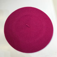 The Basque Beret has the most classic shape and is made of 100% felted wool and finished with rolled edging. Winter Rose - Dark Fuchsia