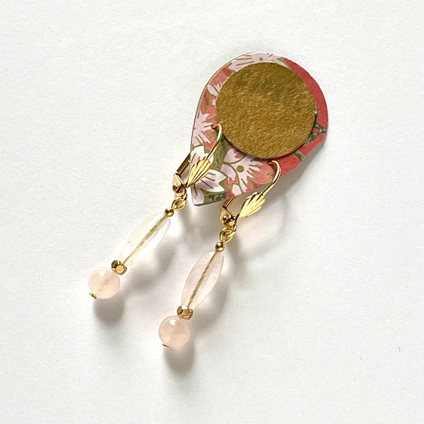 Find these handmade dangle earrings by local artisan Khalia Scott at Eclection Ottawa.  These earrings are fashioned with polished spherical and oblong rose quartz beads with gold-plated findings and lever-backed hooks. They measure approximately 1 1/2" in length and are very lightweight at 3g/pair.
