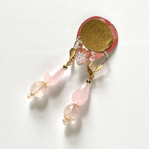 Find these handmade dangle earrings by local artisan Khalia Scott at Eclection Ottawa.  These earrings are fashioned of polished spherical rose quartz beads and teardrop-shaped faceted crystal beads with gold-plated findings and lever-backed hooks. They measure approximately 2" in length and weigh 7g/pair.