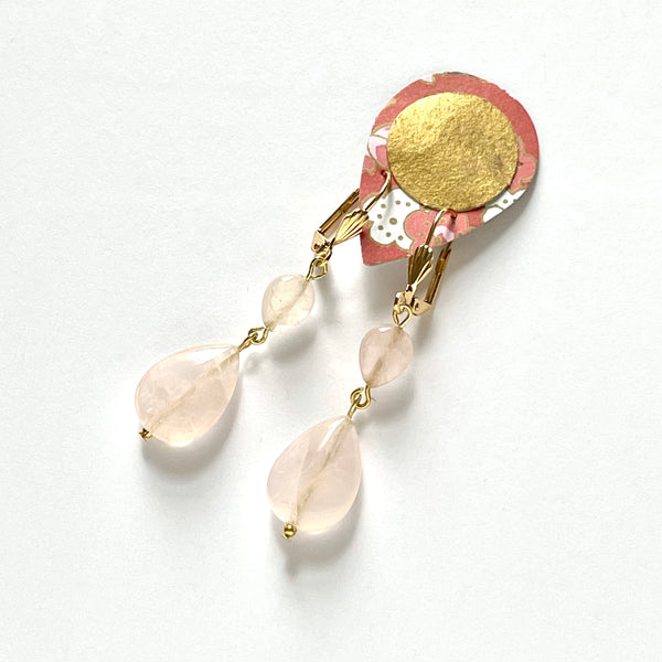 Find these handmade dangle earrings by local artisan Khalia Scott at Eclection Ottawa.  These earrings are fashioned of small and large polished teardrop-shaped rose quartz beads and are finished off with gold-plated lever-backed hooks. They measure approximately 2 1/4" in length and weigh 6g/pair.