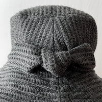 Nina Hat in charcoal Wool Blend fabric with Waffle Texture. Hand-sewn knotted bow at the back detail 