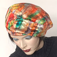 Find this handmade “Rideau” beret by local artisan Sue Scott at Eclection Ottawa. It is fashioned in luxurious poly/cotton blend panne velvet fabric featuring a fun brushstrokes print in shades of reds, pinks, blues and greens which is perfect to add colour in the colder months. This hat is fully lined with a tick, satiny, flannel-backed lining that’s easy on the hair, is wind-resistant and also gives body to this otherwise supple fabric. Size-medium: from 21 ½’’- 22 ¾" with an adjustable cord.