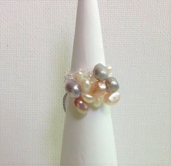 Locally hand made pearl ring. Cluster of Pinks / Light Pinks / Light Greys / White High Luster Fresh Water Pearls / Band made of Crystal Colour Czech Seed Beads / Strong and flexible Nylon thread / Size 5. At Eclection Ottawa.