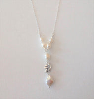 Pearls and Chain Necklace by Gaby. Central 12x13mm Keshi Fresh Water Pearl with 5 White High Luster Fresh Water Pearls / Dainty Silver Sterling Chain and Clasp / Silver Plated Leaf Connecor / 18"
