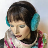 Eclection Ottawa gives you Canadian-made 100% sheepskin earmuffs in 11 bright and neutral colours. These soft and fun sheepskin earmuffs have lots of nice, warm, coverage and are also fully lined with short sheepskin on the inside to keep you warm and toasty. They feature a new suede-covered headband that you can wear as is or turned at 90 degrees for smaller-headed folks. turquoise short haired sheepskin. Black headband